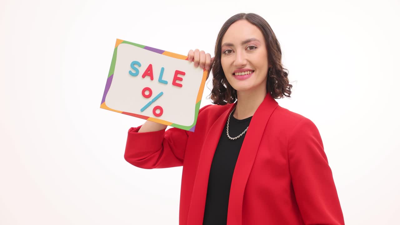 Woman holding a sale sign