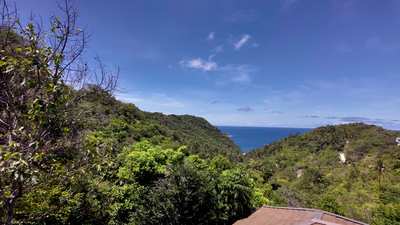 Experience serenity at a luxurious villa with pool, overlooking lush tropical hills and stunning ocean views in Koh Tao, offering a perfect getaway.