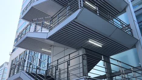 modern building architecture in tokyo with unique staircase and balcony design