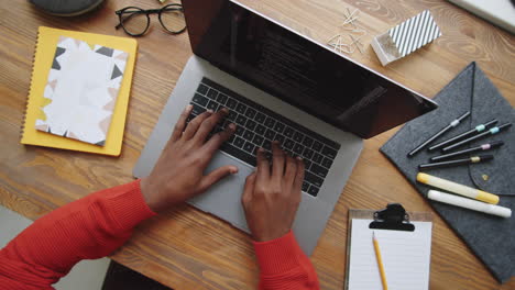 person coding on a laptop