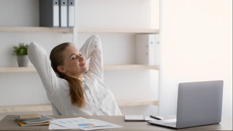 woman relaxing at her desk