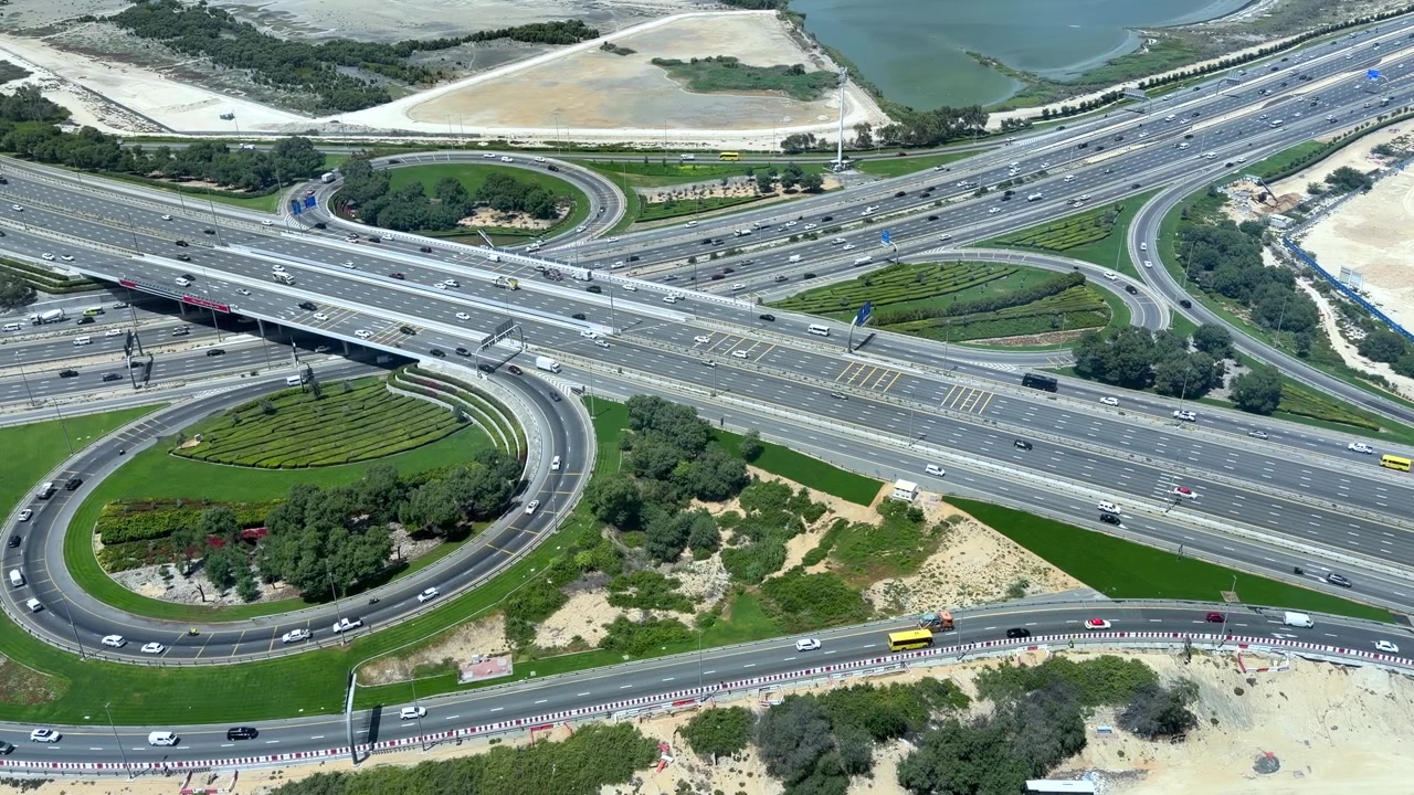 A bird’s-eye view of urban traffic on Al Khail Road in Dubai, UAE.
