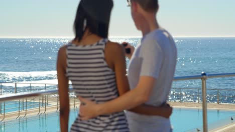 couple taking selfie on mobile phone near railings 4k