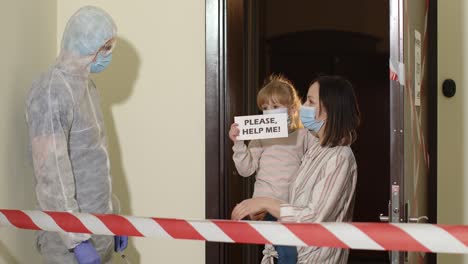 doctor with vaccine visiting mother with daughter at home offering vaccination against coronavirus