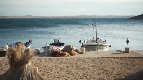 small fishing boats moored on mediterranean seaside beach