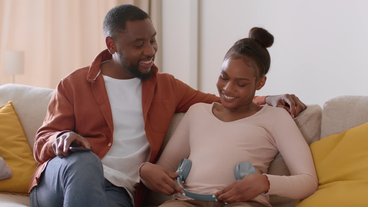 Happy Couple with Pregnant Woman