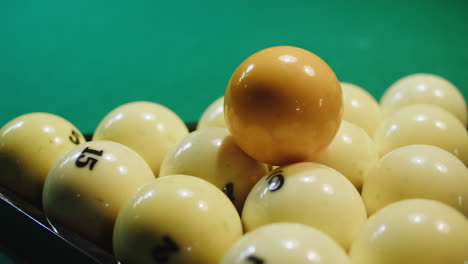 pool balls in a rack on a green table
