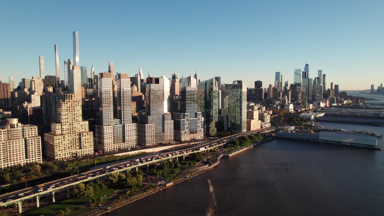 NYC midtown drone shot, sun reflecting off of skyscrapers at golden hour, 4K