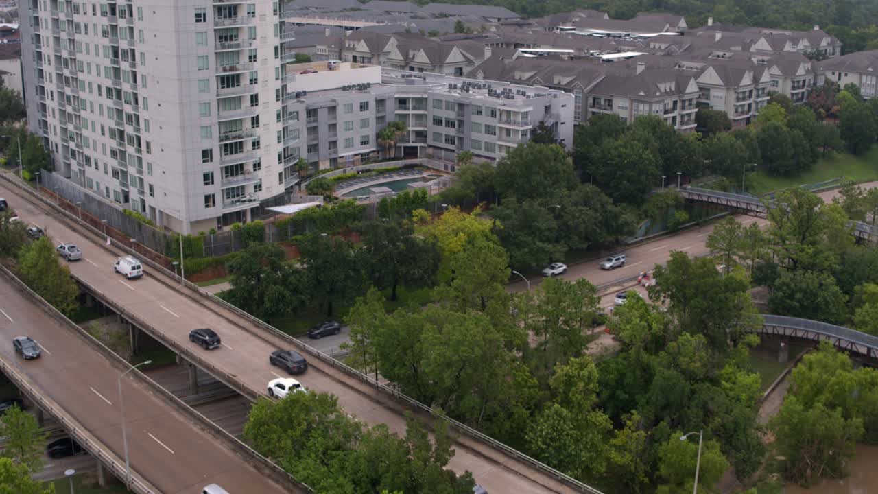 Reveal drone shot of the Buffalo Bayou and surrounding area in Houston, Texas
