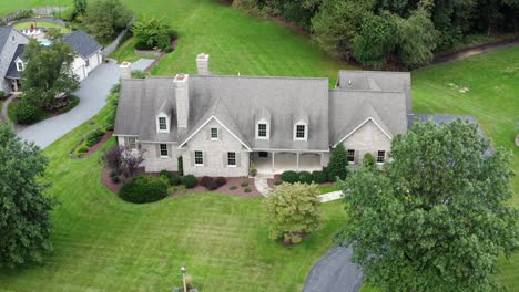 large gray stone house with chimneys