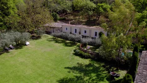 A-stone-house-nestled-amidst-dense-trees-exudes-a-magical-and-picturesque-ambiance