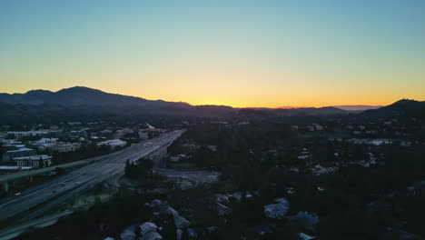 aerial drone shot over an expressway alongside posh real estate in walnut creek, california, usa during morning time