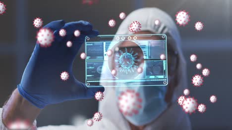 Covid-19-cells-floating-over-male-health-worker-holding-futuristic-screen-with-data-processing