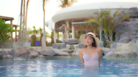 asian model summer swimsuit look at pool