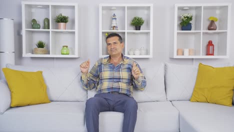 old man dancing happily by himself at home.