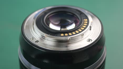 cleaning a camera lens with a brush