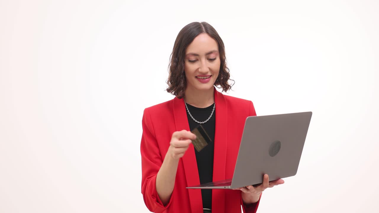 Woman using laptop for online shopping with a credit card