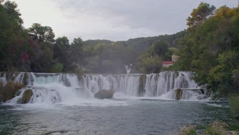 flying over the beautiful krka waterfalls in krka national park during sunrise with no people, aerial