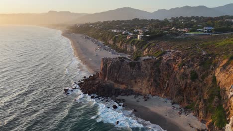 hazy sunset coastal ocean aerial over pt dume at malibu, california