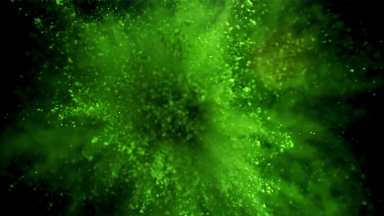 Levende grøn pulvereksplosion i slowmotion