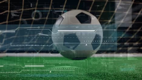 Animation-of-digital-data-processing-over-football-bouncing-on-pitch-in-front-of-net
