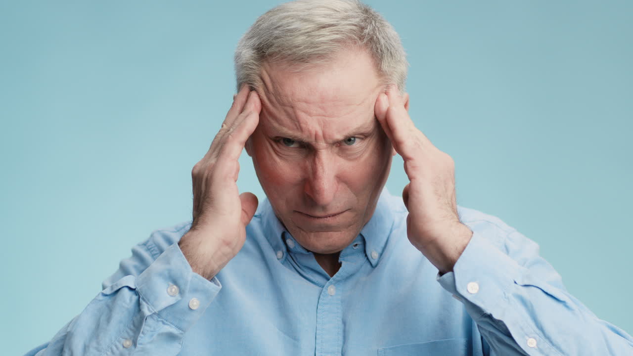 Senior Man Suffering from Headache