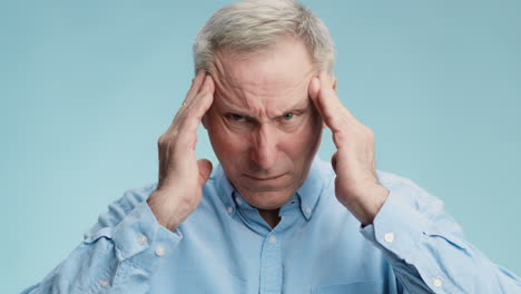 senior man suffering from headache