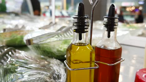 olive oil and vinegar dressing at a salad bar