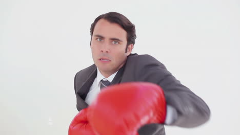 serious man using boxing gloves