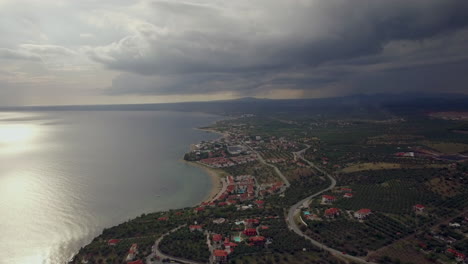 Flying-over-Trikorfo-Beach-coast-and-sea-on-overcast-day-Greece