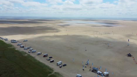 Drone-shot-beach-on-coast-of-Denmark-with-motorhomes-and-blokarts