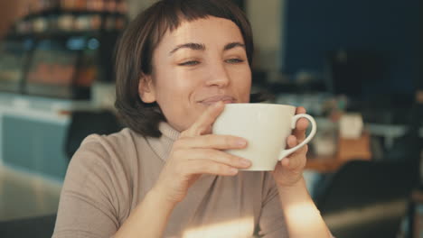 portrait of female having a cup of coffee