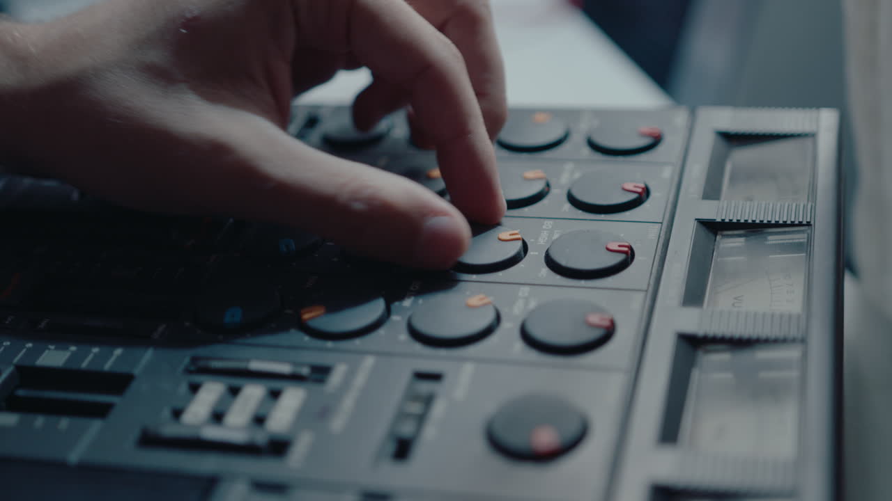 Hand of Musician Using Vintage Multitrack Cassette Recorder