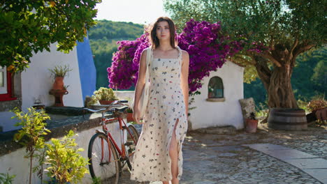 feminine model enjoying mediterranean trip walking. tender lady touching hair