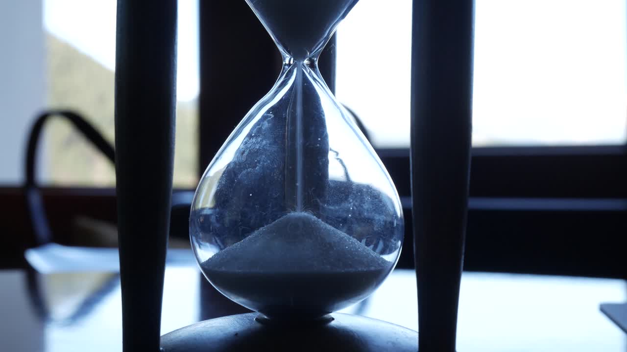 Hourglass close-up shot. Time is up