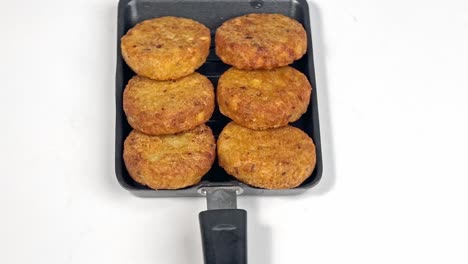 Aloo-Tikki-Ragda-Patties-Cutlet-is-a-popular-snack-or-snack-from-India,-Served-with-Tomato-Ketchup-or-Imli-chutney-over-background