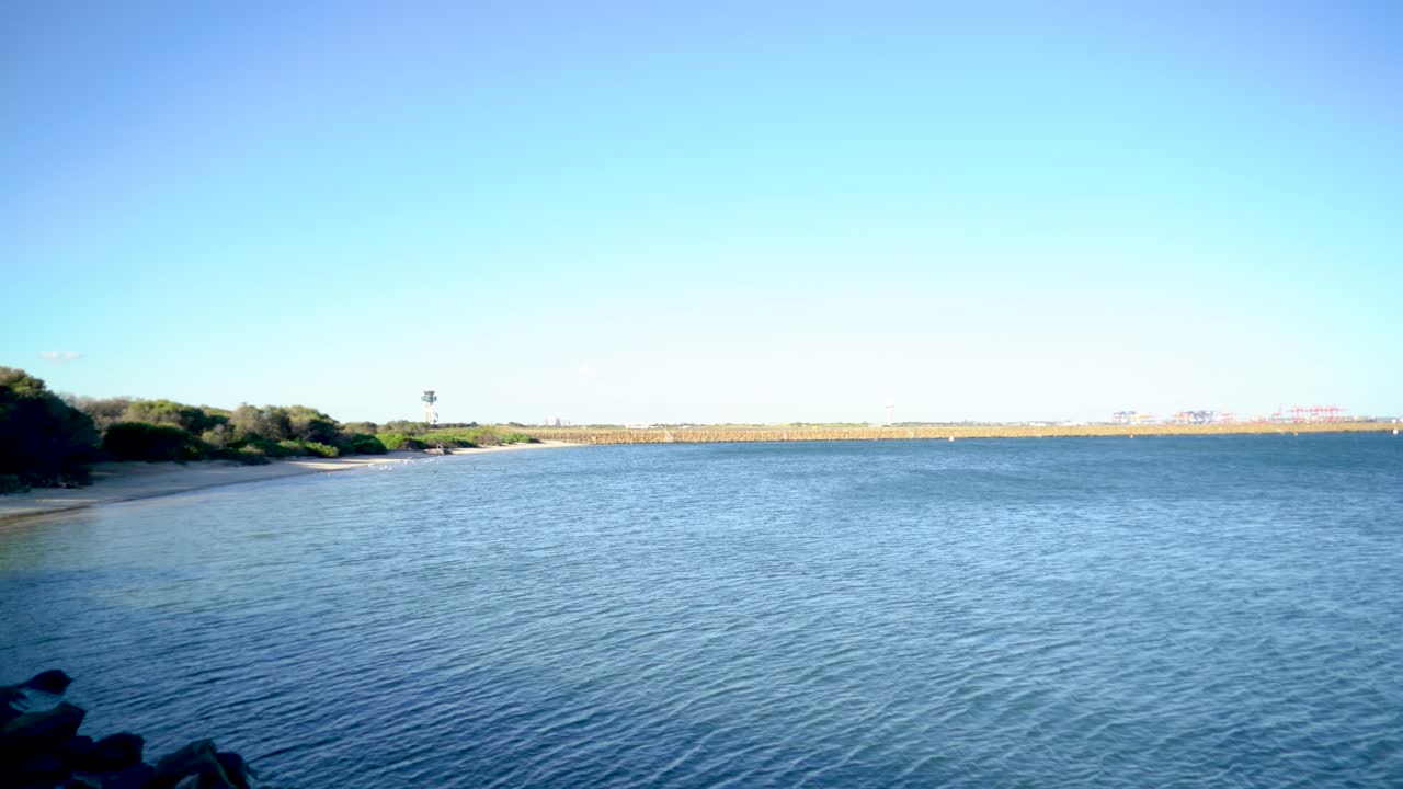 Tilt up to reveal Sydney Airport on a clear day
