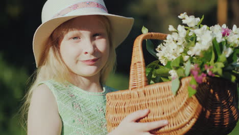 Portrait-Of-A-Fair-Haired-Girl-Of-Seven-Years-With-A-Basket-Of-Wildflowers-4K-Video