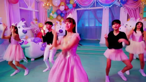 cute girl group dance performance in pink unicorn princess theme