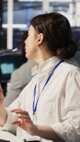vertical video data center software developer using pc to monitor neural networks
