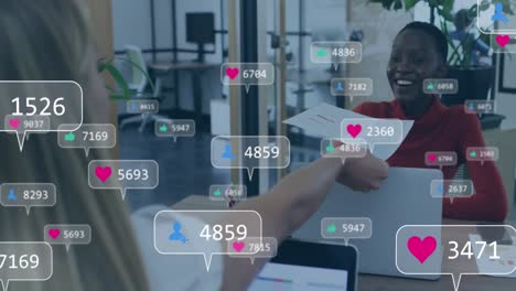 animation of social media icons over business people in office