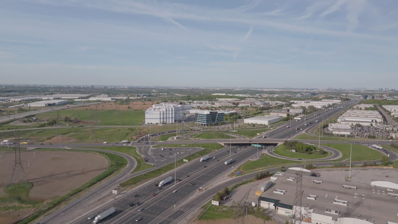 Highway 401 in mississauga, canada, with busy traffic on a sunny day, aerial view