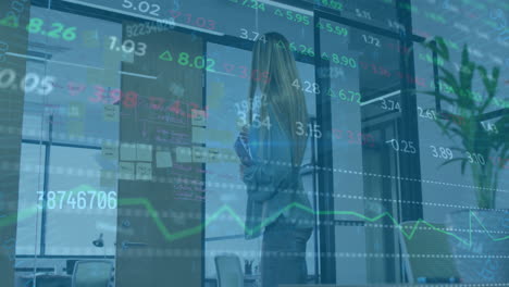 animation of financial data processing over biracial businesswoman working in office