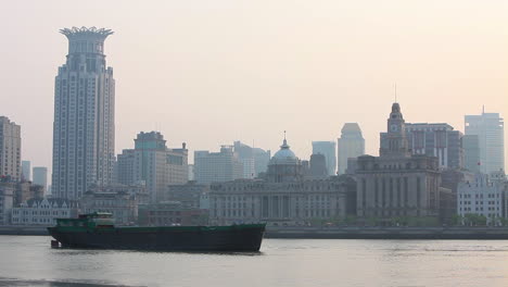 a barge travels on the pearl river in shanghai china in smog and fog 3