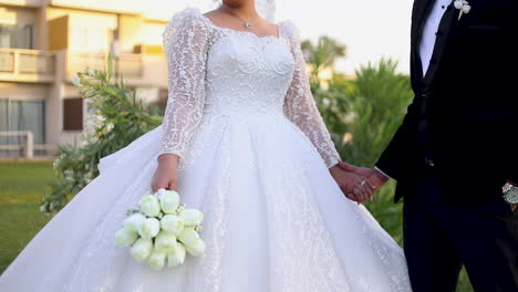 Bride-and-Groom-with-a-Bouquet-in-the-garden---pan-right---medium-shot