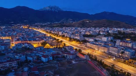 night cityscape with mountain backdrop