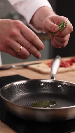 adding thyme to a pan