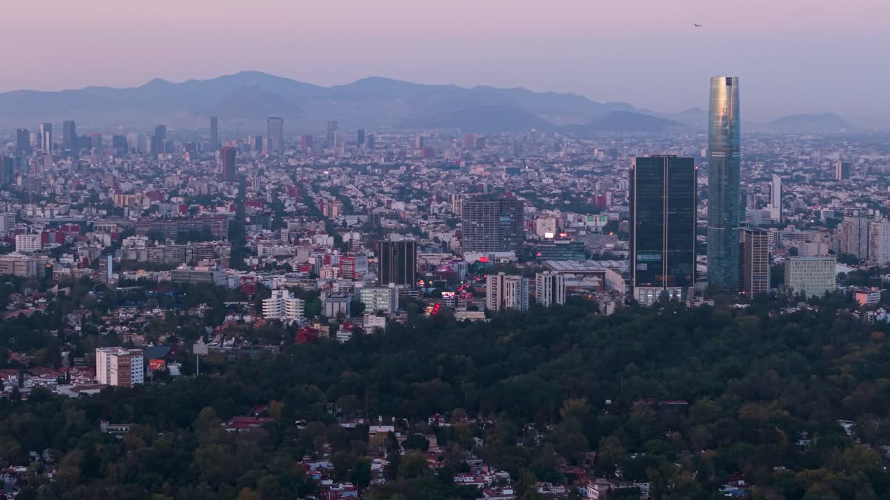 Drone footage showing purple twilight tones over south Mexico City