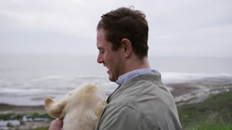 man in a wheelchair spending time with his dog