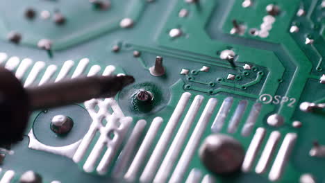 The-engineer-replaced-the-IC-transistor-with-a-soldering-iron-on-the-electrical-circuit-PCB-board-to-fix-device-device